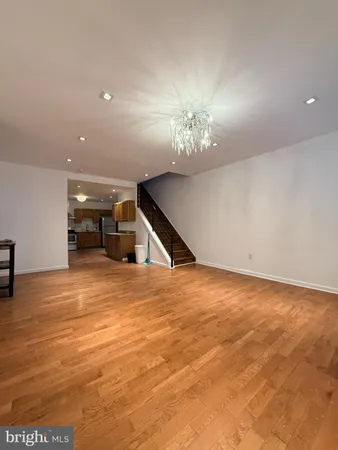 a view of empty room with a chandelier