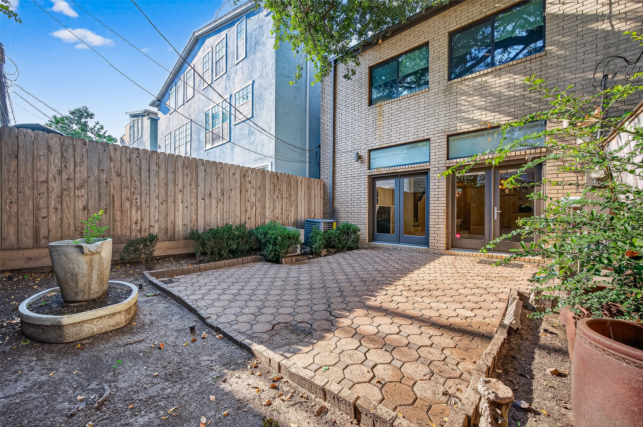 3027 Bissonnet Street Houston, TX 77005 - Photo 46 of 47 Spacious paved courtyard with mature landscaping — more outdoor space than you'd expect from a central Houston rental