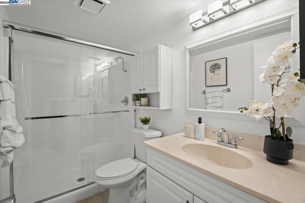 2253 Kalenda Common Fremont, CA 94539 - Photo 11 of 38 a bathroom with a sink toilet and shower