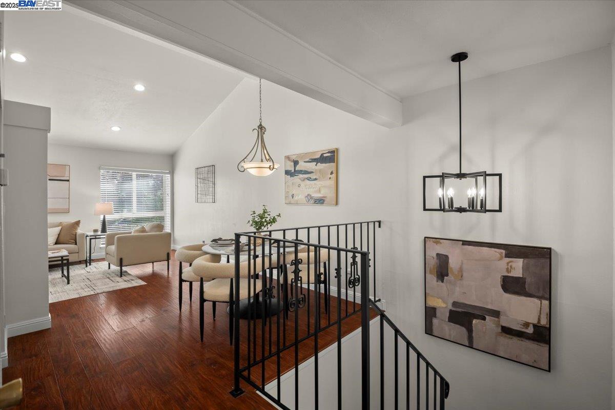 2253 Kalenda Common Fremont, CA 94539 - Photo 13 of 38 a view of a hallway with dining room and wooden floor