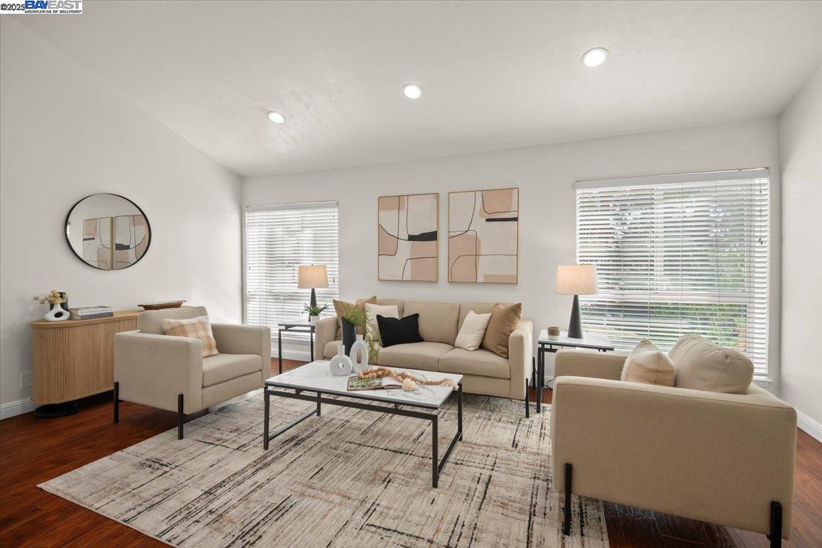 2253 Kalenda Common Fremont, CA 94539 - Photo 16 of 38 a living room with furniture a table and a large window