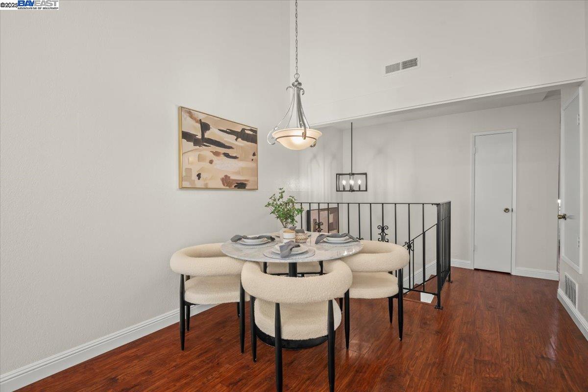 2253 Kalenda Common Fremont, CA 94539 - Photo 18 of 38 a view of a dining room with furniture and wooden floor