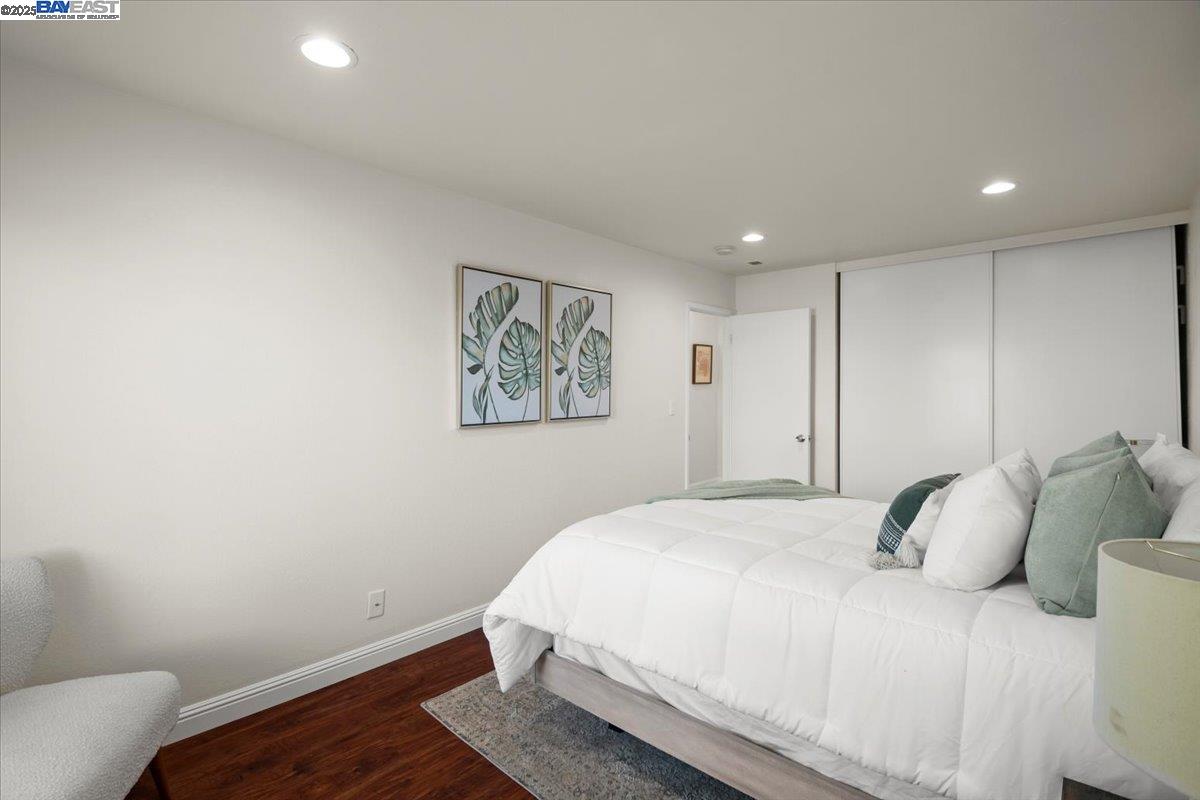 2253 Kalenda Common Fremont, CA 94539 - Photo 23 of 38 a bedroom with a bed and painting on the wall