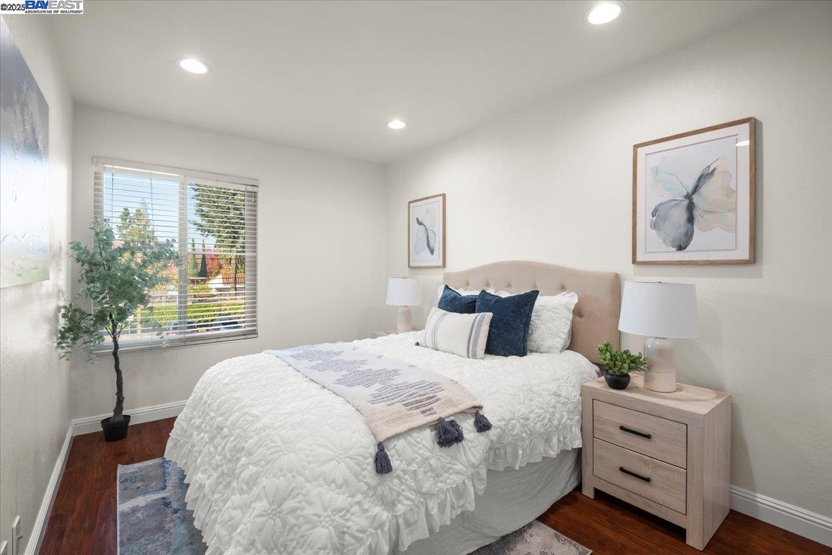 2253 Kalenda Common Fremont, CA 94539 - Photo 24 of 38 a spacious bedroom with a bed and a window