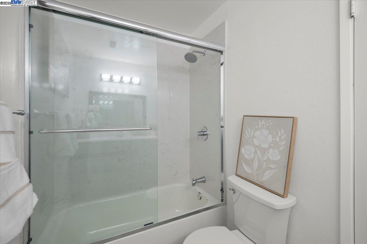 2253 Kalenda Common Fremont, CA 94539 - Photo 27 of 38 a bathroom with a shower and toilet
