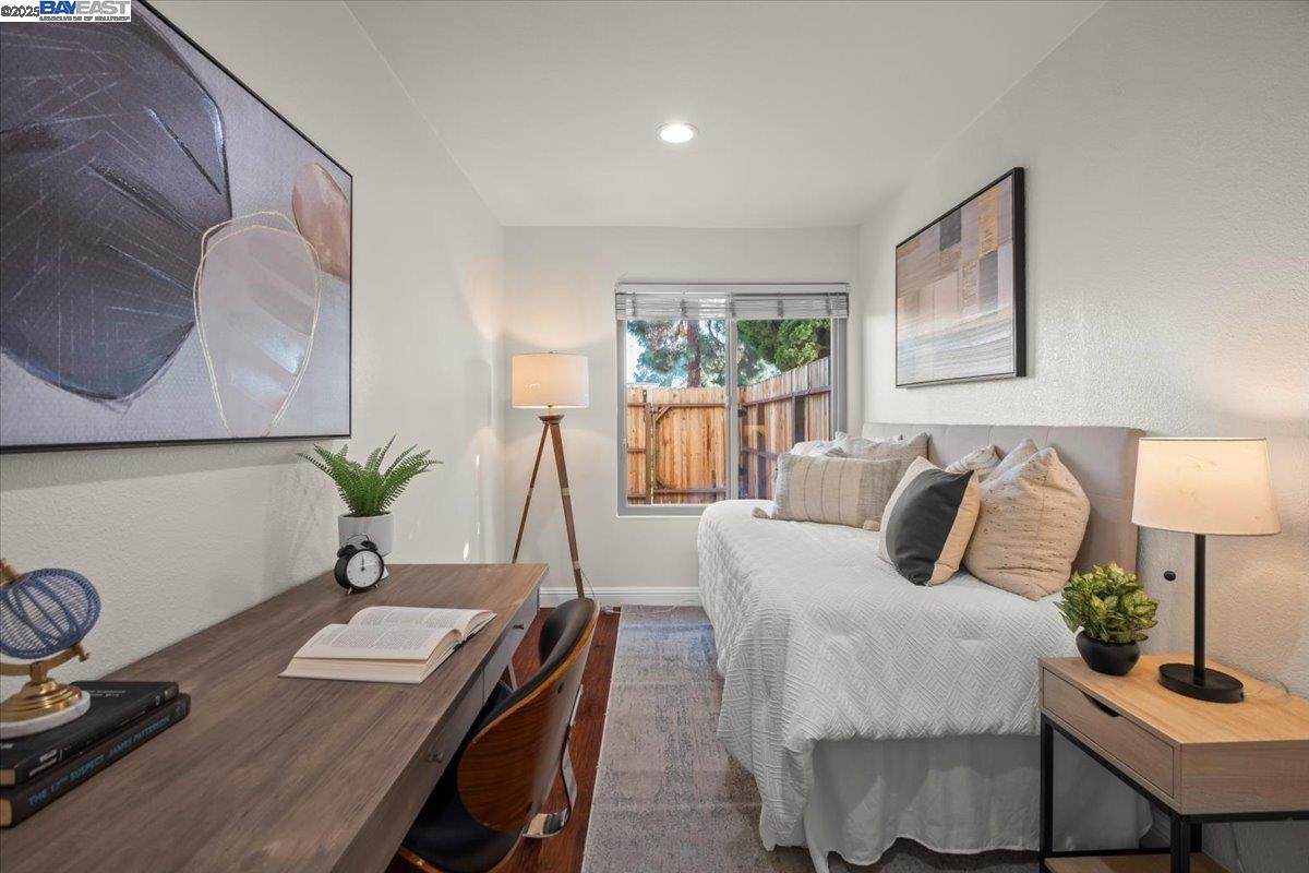 2253 Kalenda Common Fremont, CA 94539 - Photo 9 of 38 a bedroom with a bed window and table