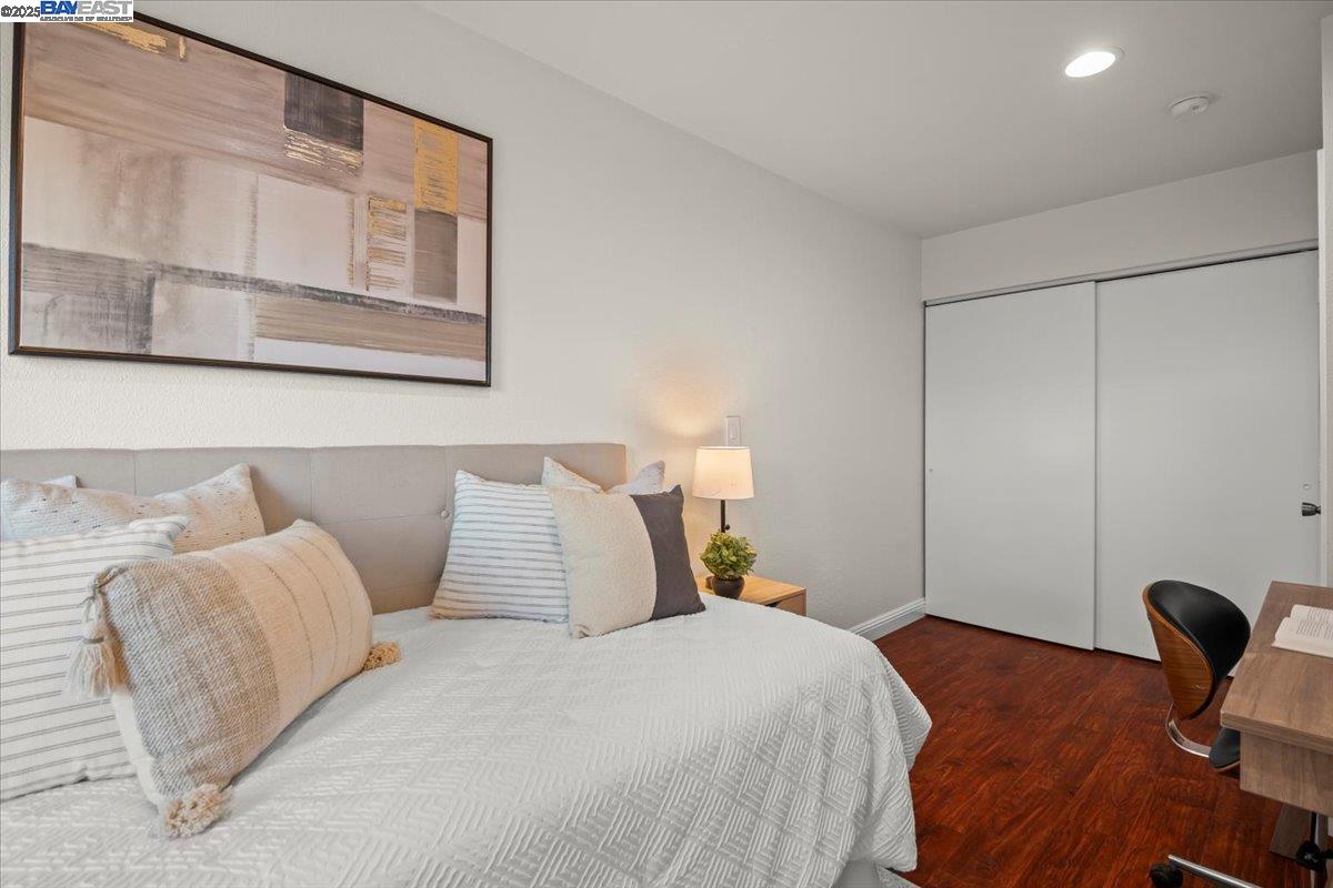 2253 Kalenda Common Fremont, CA 94539 - Photo 10 of 38 a bedroom with a bed and a large mirror