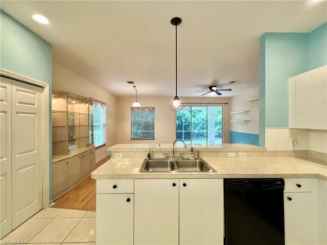 a kitchen with sink and window