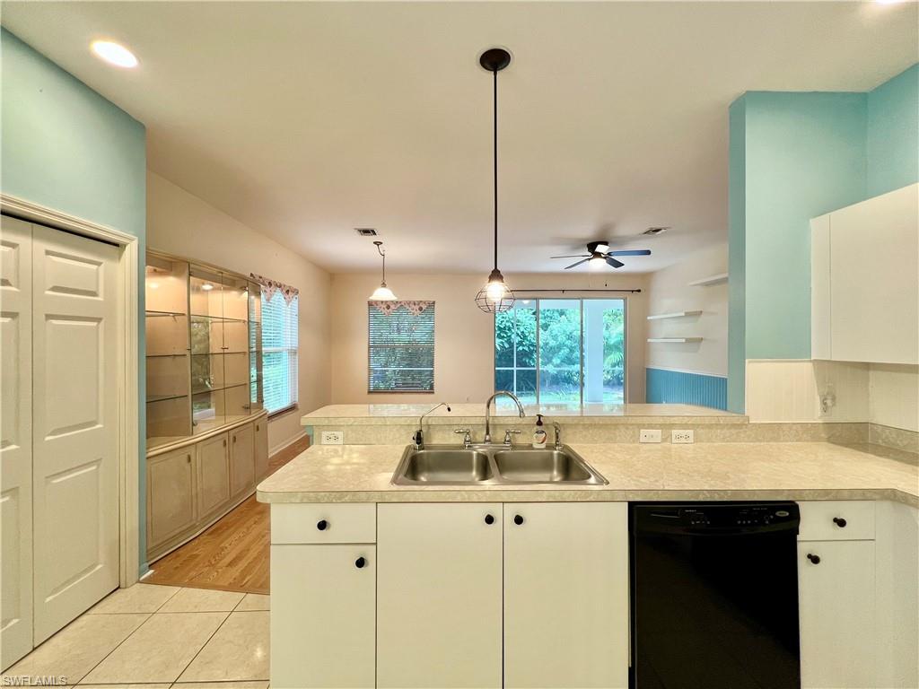 443 Crossfield Circle, Unit 74 Naples, FL 34104 - Photo 11 of 45 a kitchen with sink and window
