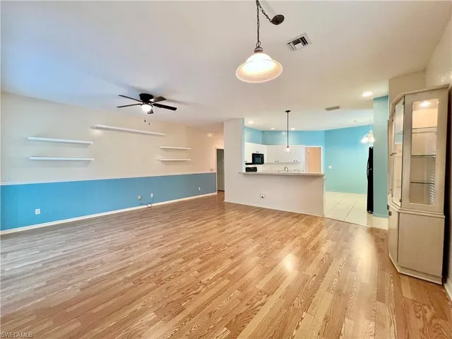 a view of a kitchen with a sink and an oven