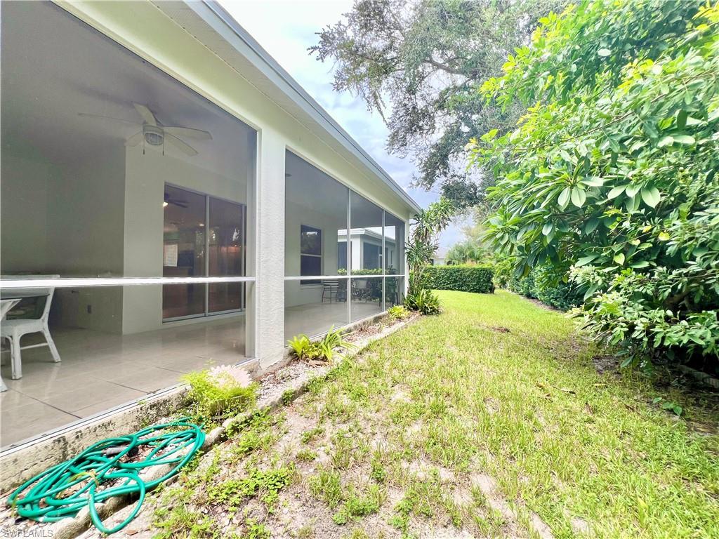 443 Crossfield Circle, Unit 74 Naples, FL 34104 - Photo 20 of 45 a view of backyard with seating space
