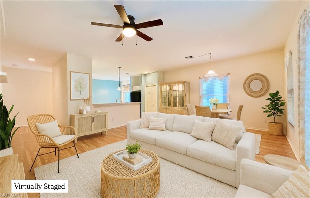 443 Crossfield Circle, Unit 74 Naples, FL 34104 - Photo 2 of 45 a living room with furniture and kitchen view