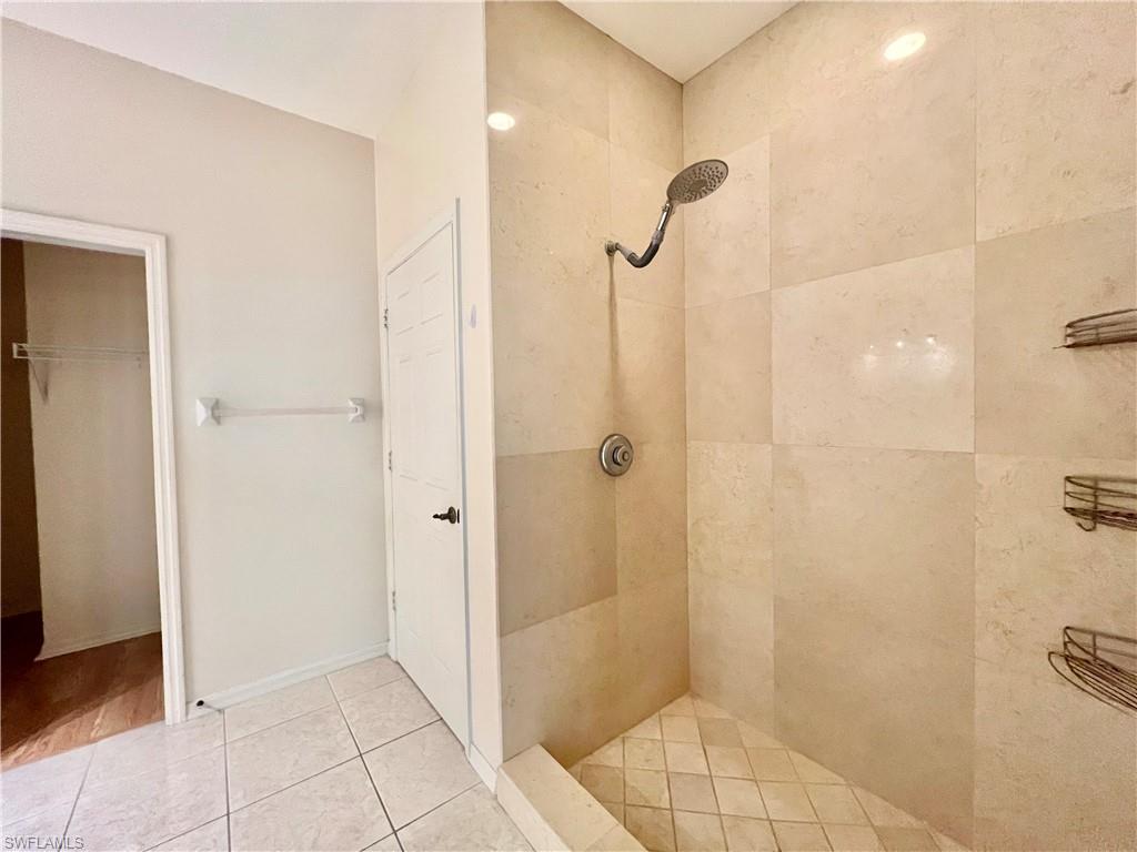 443 Crossfield Circle, Unit 74 Naples, FL 34104 - Photo 26 of 45 a bathroom with a shower