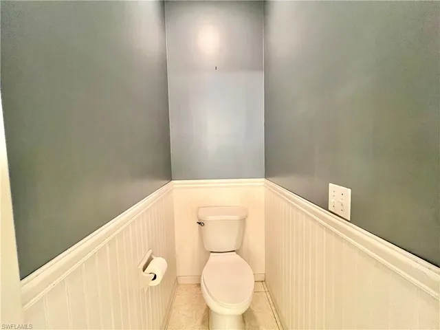 a bathroom with a toilet and a sink