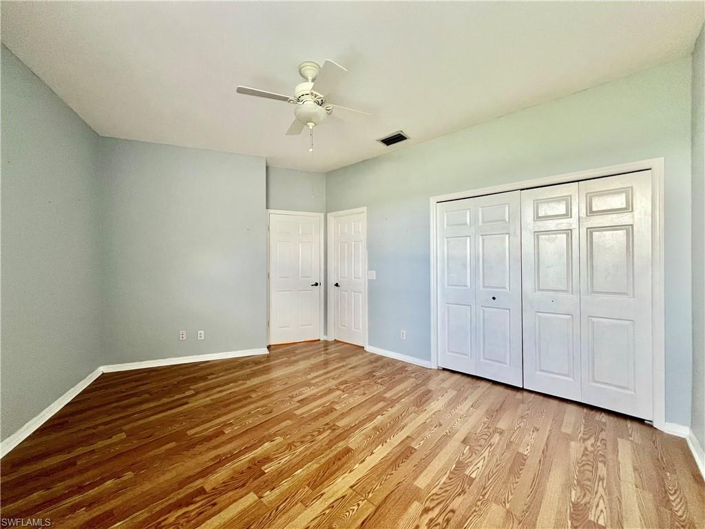 443 Crossfield Circle, Unit 74 Naples, FL 34104 - Photo 36 of 45 a view of an empty room and wooden floor