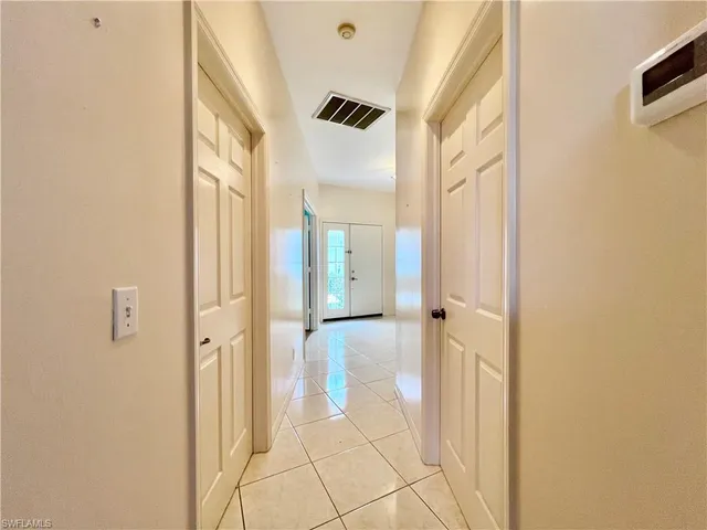 a bathroom with a glass shower door and a mirror