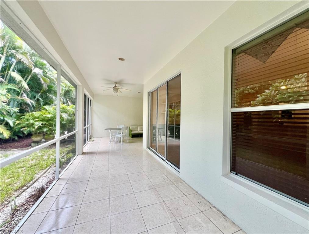 443 Crossfield Circle, Unit 74 Naples, FL 34104 - Photo 40 of 45 a view of a porch with furniture