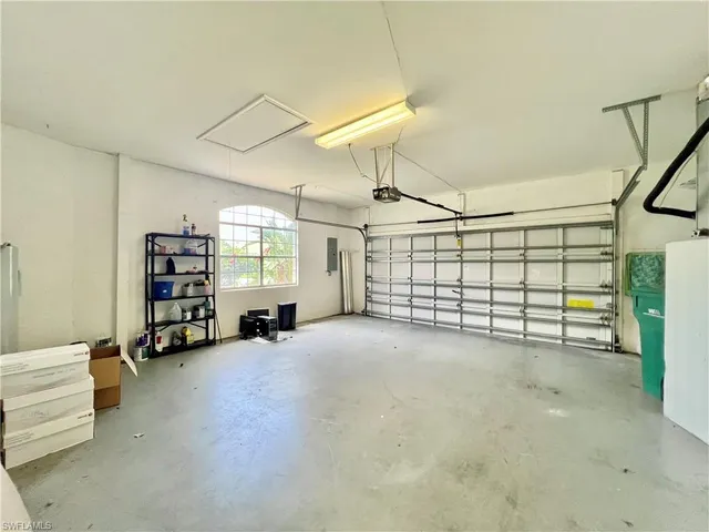 a view of a livingroom with toys and a chandelier