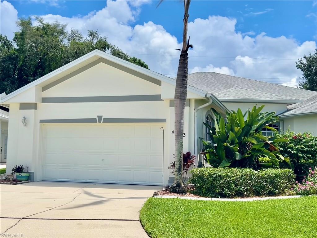 443 Crossfield Circle, Unit 74 Naples, FL 34104 - Photo 45 of 45 a house with a yard