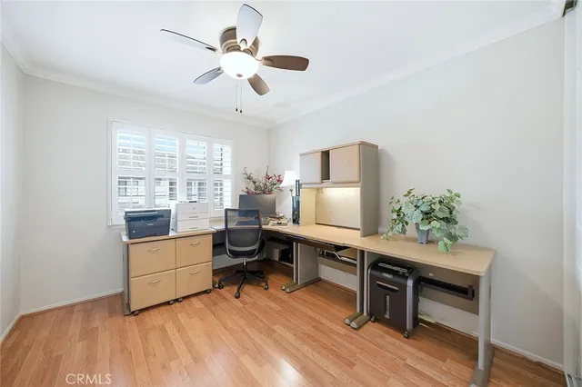 a workspace with furniture window and wooden floor