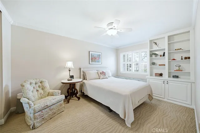 a bed room with a bed and a chandelier