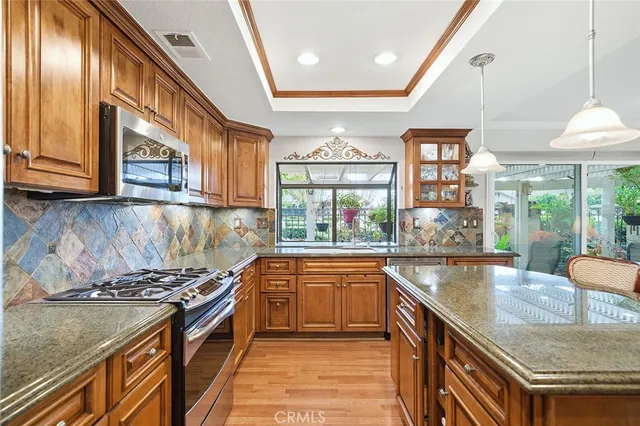 a kitchen with a stove and a sink