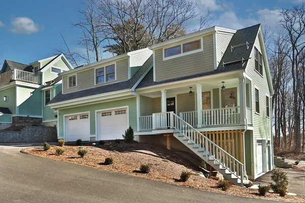 a front view of a house with a garage