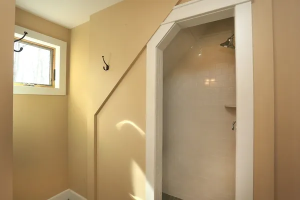 a view of a bathroom from a hallway