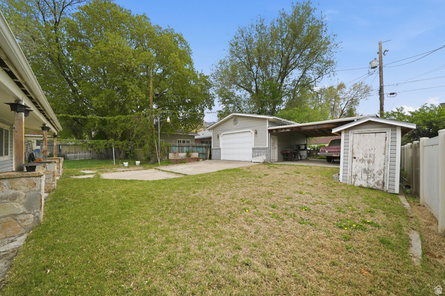 977 23rd Street Ogden, UT 84401 - Photo 27 of 29 View of yard featuring driveway and a shed