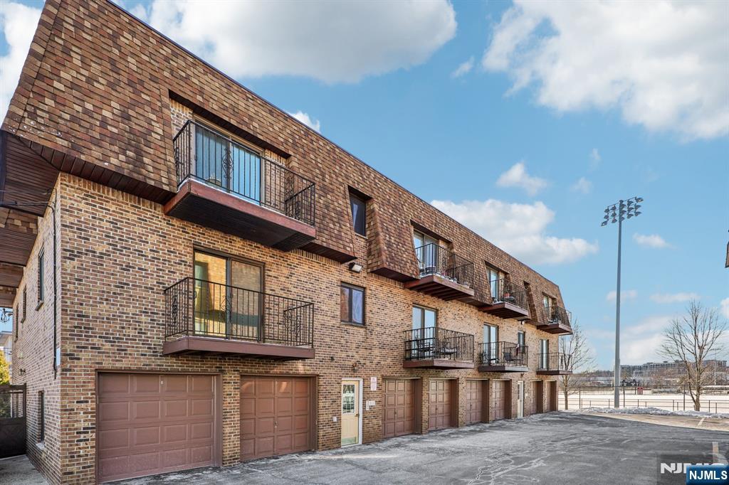 825 Riverside Avenue, Unit 207 Lyndhurst, NJ 07071 - Photo 1 of 18 a view of a building with a street