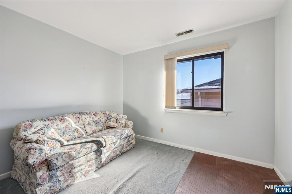 825 Riverside Avenue, Unit 207 Lyndhurst, NJ 07071 - Photo 13 of 18 a bedroom with a bed and window