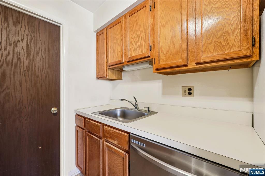 825 Riverside Avenue, Unit 207 Lyndhurst, NJ 07071 - Photo 8 of 18 a kitchen with a sink and cabinets