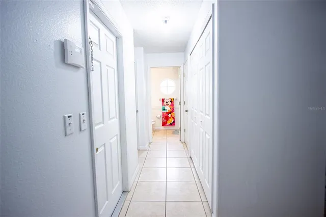 a bedroom with bed and a chandelier