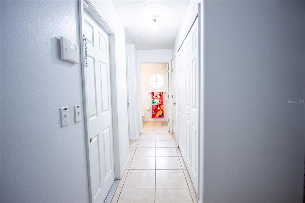 1832 Wimbledon Street Kissimmee, FL 34743 - Photo 20 of 39 a view of a hallway with wooden floor and staircase