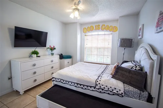 a bathroom with a sink mirror and toilet