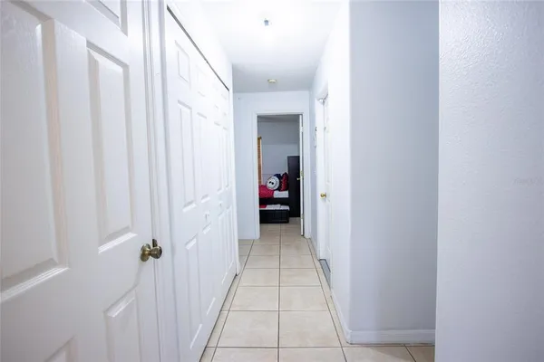 a view of an house with backyard space and porch