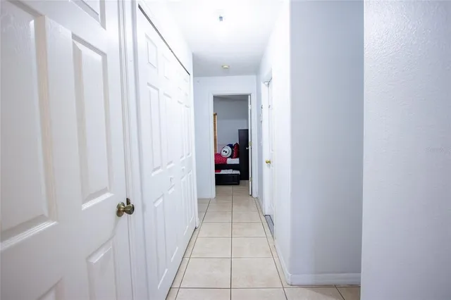 a view of an house with backyard space and porch