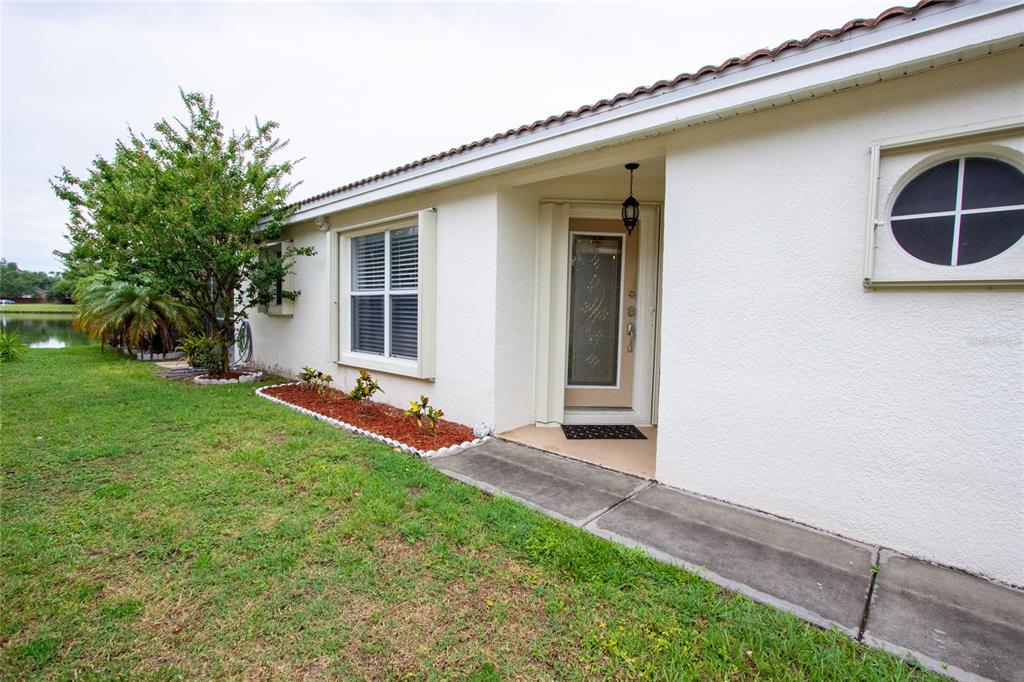 1832 Wimbledon Street Kissimmee, FL 34743 - Photo 28 of 39 a view of an house with backyard space and porch