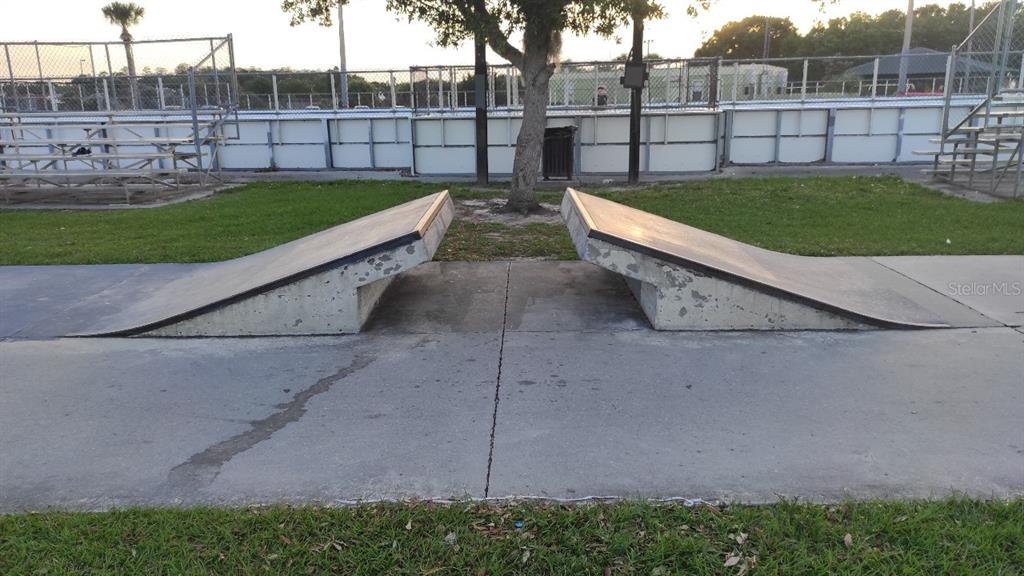 1832 Wimbledon Street Kissimmee, FL 34743 - Photo 30 of 39 a view of a backyard with a garden and plants