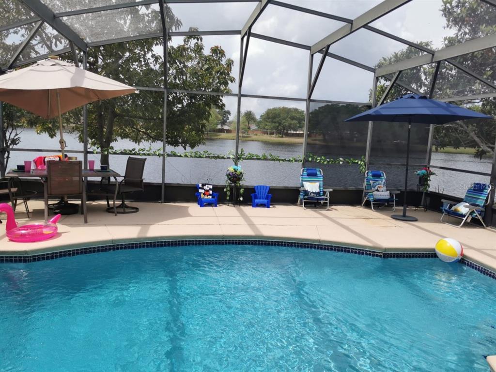 1832 Wimbledon Street Kissimmee, FL 34743 - Photo 33 of 39 a view of a swimming pool with a patio