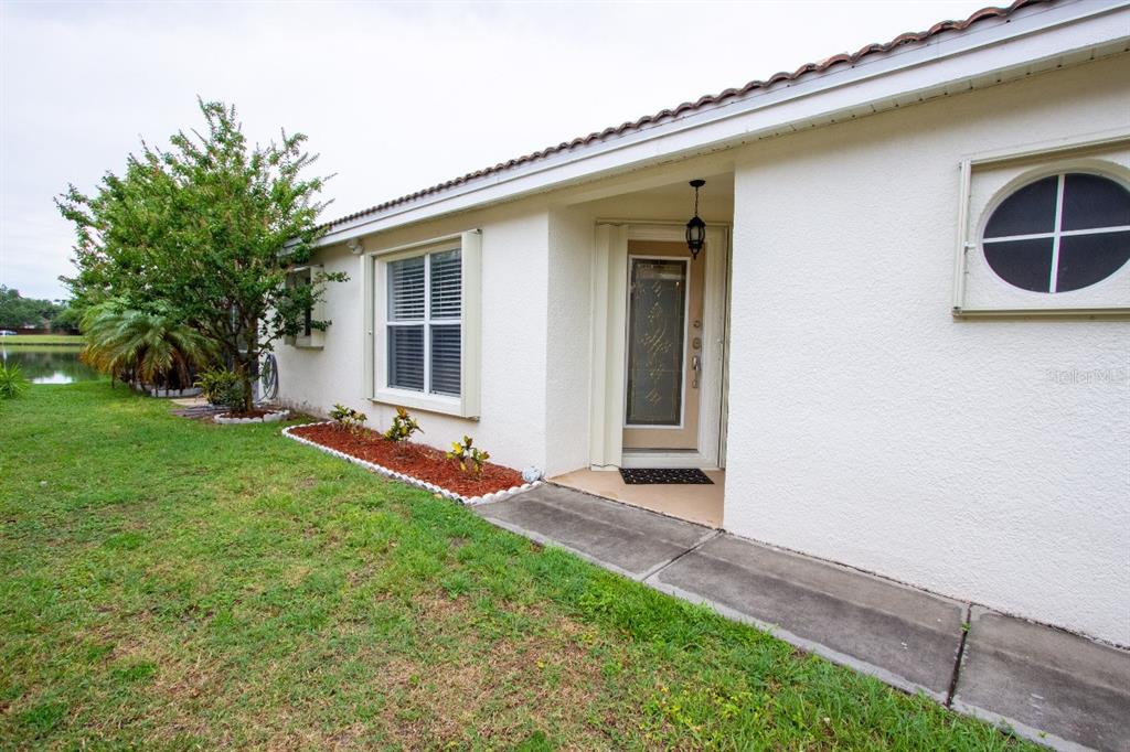 1832 Wimbledon Street Kissimmee, FL 34743 - Photo 37 of 39 a view of an house with backyard space and porch