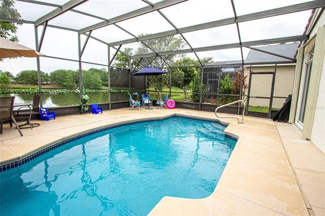 a view of a swimming pool with a patio