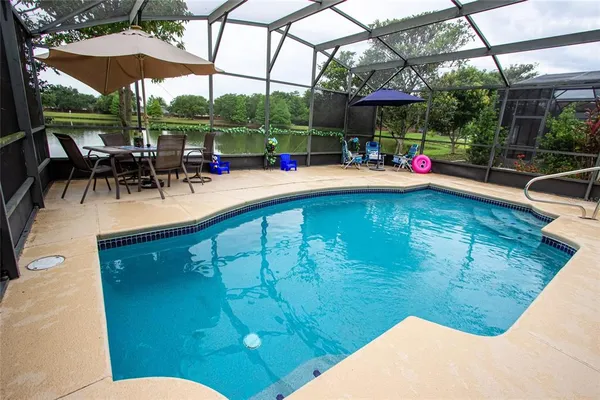 a view of a swimming pool with a patio