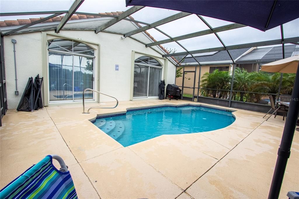 1832 Wimbledon Street Kissimmee, FL 34743 - Photo 6 of 39 a view of a swimming pool with a patio