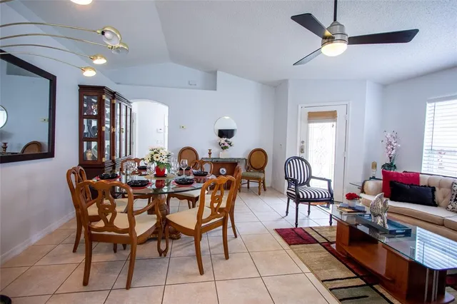 a kitchen with kitchen island granite countertop a sink appliances and cabinets