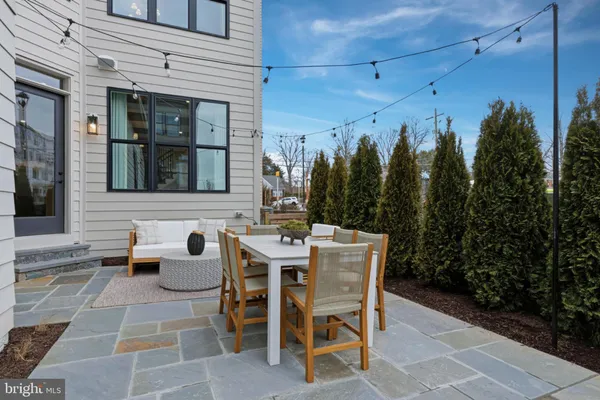 a view of a patio with a table and chairs