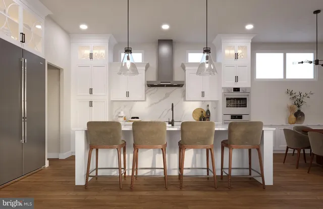 a large kitchen with a table and chairs