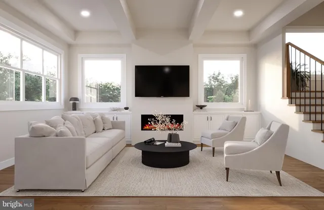 a living room with furniture a flat screen tv and a large window