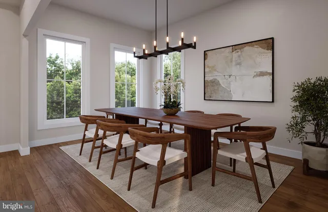 a view of a dining room with furniture window and wooden floor