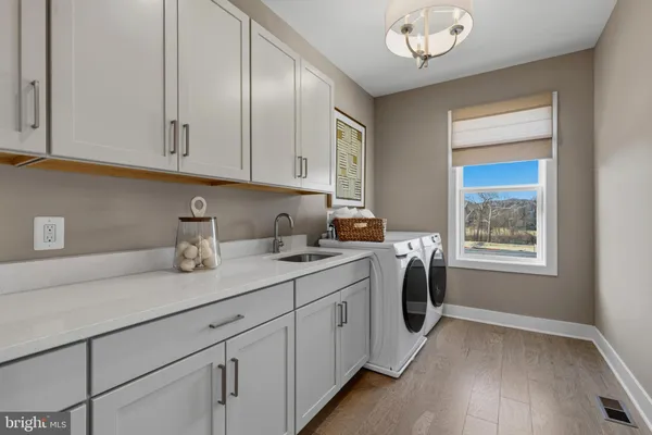 a kitchen with a sink and cabinets